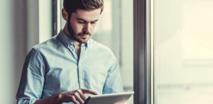 man-using-tablet-with-iwms-software